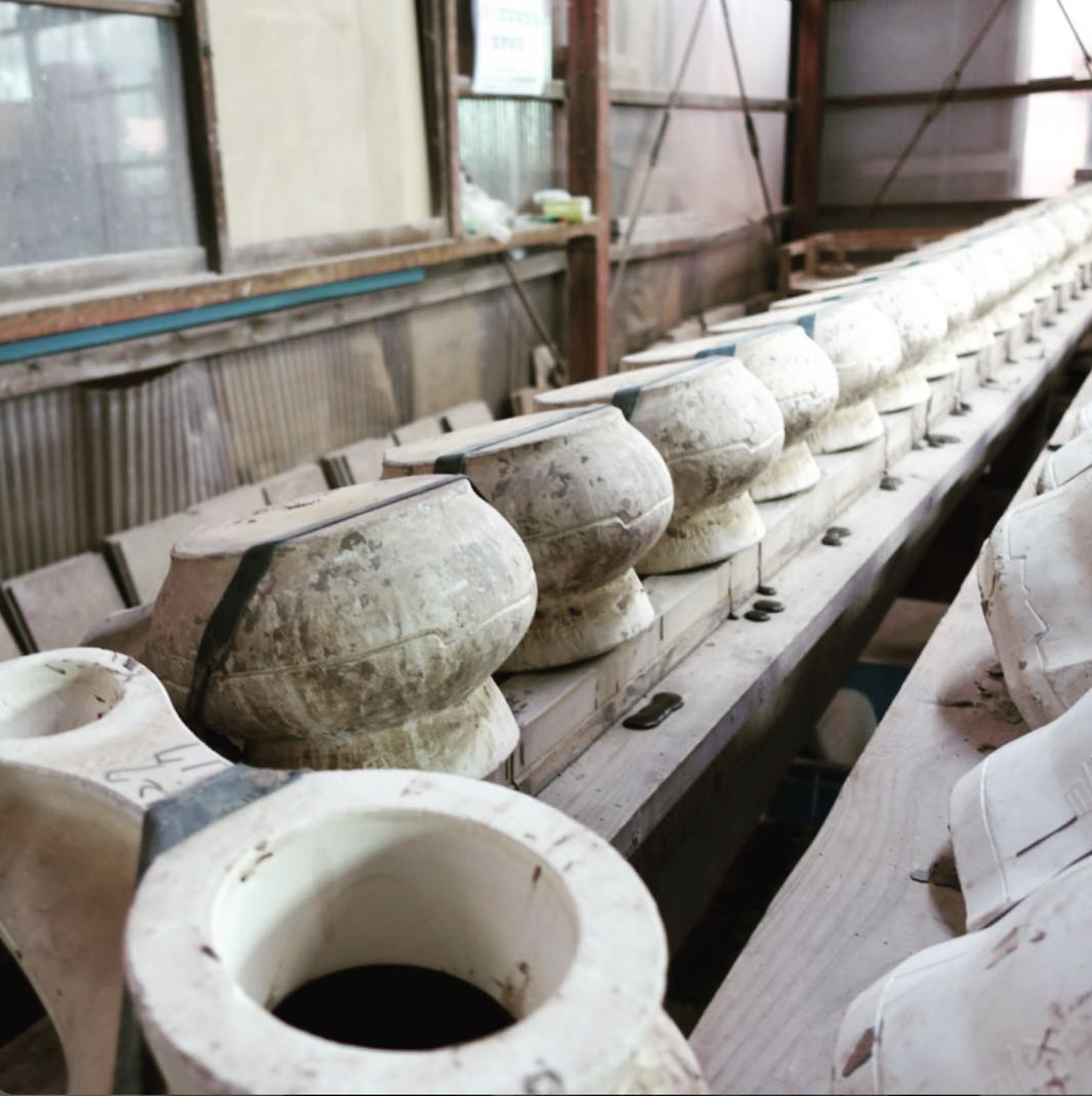 Ceramic molds lined up in the Japanese workshop